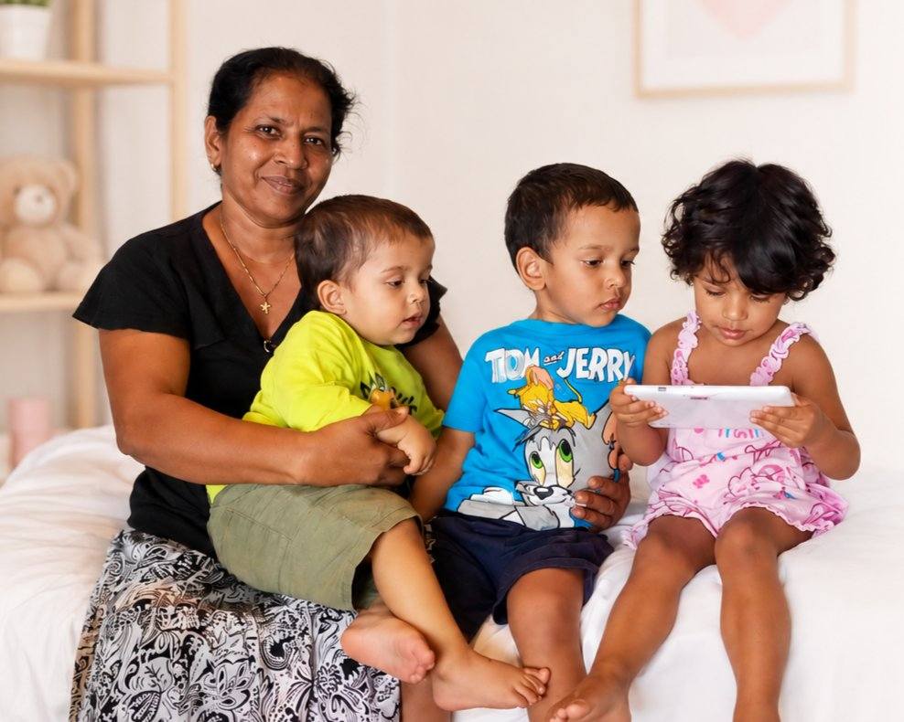 Caring nanny with a happy child in a warm home setting